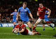 24 February 2017; Conor Oliver of Munster scores his side's third try despite the efforts of Jonathan Evans of Scarlets during the Guinness PRO12 Round 16 match between Munster and Scarlets at Thomond Park in Limerick. Photo by Diarmuid Greene/Sportsfile