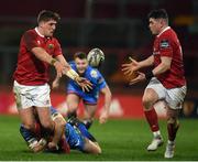 24 February 2017; Dan Goggin, left, of Munster offloads to team-mate Ronan O'Mahony as he is tackled by Hadleigh Parkes off Scarlets during the Guinness PRO12 Round 16 match between Munster and Scarlets at Thomond Park in Limerick. Photo by Diarmuid Greene/Sportsfile