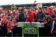 25 February 2017; Cuala supporters celebrate behind Sean Moran as he is interviewed by TG4 following the AIB GAA Hurling All-Ireland Senior Club Championship Semi-Final match between Cuala and Slaughtneil at the Athletic Grounds in Armagh. Photo by Eóin Noonan/Sportsfile