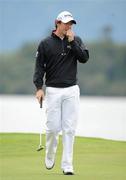 30 July 2011; Rory McIlroy reacts after missing a putt on the 4th green during the third round of the 2011 Discover Ireland Irish Open Golf Championship, Killarney Golf & Fishing Club, Killarney, Co. Kerry. Picture credit: Diarmuid Greene / SPORTSFILE