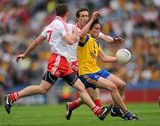 30 July 2011; Sean O'Grady, Roscommon, in action against Philip Jordan, left, and Colm Cavanagh, Tyrone. GAA Football All-Ireland Senior Championship Qualifier, Round 4, Roscommon v Tyrone, Croke Park, Dublin. Picture credit: Ray McManus / SPORTSFILE
