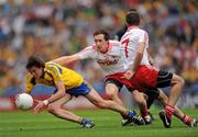 30 July 2011; Sean O'Grady, Roscommon, in action against Philip Jordan, 7, and Colm Cavanagh, Tyrone. GAA Football All-Ireland Senior Championship Qualifier, Round 4, Roscommon v Tyrone, Croke Park, Dublin. Picture credit: Ray McManus / SPORTSFILE