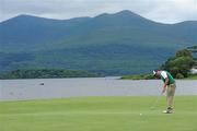 30 July 2011; Paul Cutler watches his putt on the first green during the third round of the 2011 Discover Ireland Irish Open Golf Championship, Killarney Golf & Fishing Club, Killarney, Co. Kerry. Picture credit: Matt Browne / SPORTSFILE