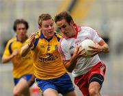 30 July 2011; Mark Donnelly, Tyrone, in action against Peter Domican, Roscommon. GAA Football All-Ireland Senior Championship Qualifier, Round 4, Roscommon v Tyrone, Croke Park, Dublin. Picture credit: Dáire Brennan / SPORTSFILE