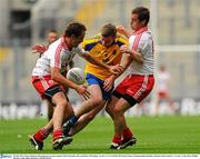 30 July 2011; Peter Domican, Roscommon, in action against Mark Donnelly, left, and Brian McGuigan, Tyrone. GAA Football All-Ireland Senior Championship Qualifier, Round 4, Roscommon v Tyrone, Croke Park, Dublin. Picture credit: Dáire Brennan / SPORTSFILE