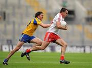 30 July 2011; Kyle Coney, Tyrone, in action against Senan O'Grady, Roscommon. GAA Football All-Ireland Senior Championship Qualifier, Round 4, Roscommon v Tyrone, Croke Park, Dublin. Picture credit: Oliver McVeigh / SPORTSFILE