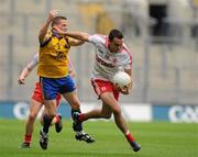 30 July 2011; Kyle Coney, Tyrone, in action against Sean McDermott, Roscommon. GAA Football All-Ireland Senior Championship Qualifier, Round 4, Roscommon v Tyrone, Croke Park, Dublin. Picture credit: Oliver McVeigh / SPORTSFILE