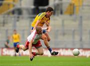 30 July 2011; Kevin Hughes, Tyrone, in action against Karol Mannion, Roscommon. GAA Football All-Ireland Senior Championship Qualifier, Round 4, Roscommon v Tyrone, Croke Park, Dublin. Picture credit: Dáire Brennan / SPORTSFILE