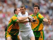 30 July 2011; Ronan Sweeney, Kildare, in action against Neil McGee, left, and Mark McHugh, Donegal. GAA Football All-Ireland Senior Championship Quarter-Final, Donegal v Kildare, Croke Park, Dublin. Picture credit: Dáire Brennan / SPORTSFILE
