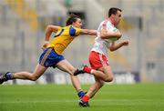 30 July 2011; Kyle Coney, Tyrone, in action against Sean McDermott, Roscommon. GAA Football All-Ireland Senior Championship Qualifier, Round 4, Roscommon v Tyrone, Croke Park, Dublin. Picture credit: Oliver McVeigh / SPORTSFILE