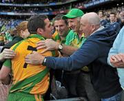 30 July 2011; Donegal winning point scorer Kevin Cassidy is congratulated by his Gaoth Dobhair club-mates Tom Mike Gillespie, right, and Frank Magee, green hat. GAA Football All-Ireland Senior Championship Quarter-Final, Donegal v Kildare, Croke Park, Dublin. Picture credit: Dáire Brennan / SPORTSFILE