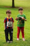 31 July 2011; Five year old cousins Matthew and Jennifer Burns, from Tempelogue, Dublin, await the start of the Athletics Ireland Family Fitness Festival at Farmleigh. Phoenix Park, Dublin. Picture credit: Ray McManus / SPORTSFILE