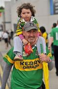 31 July 2011; Kerry supporter Lorna Corcoran, from Tralee, Co. Kerry, gets a lift to the match with her dad Aidan. GAA Football All-Ireland Senior Championship Quarter-Final, Kerry v Limerick, Croke Park, Dublin. Picture credit: Diarmuid Greene / SPORTSFILE