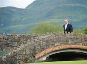 31 July 2011; An Taoiseach Enda Kenny T.D. makes his way to the first fairway to watch the golf during the final round of the 2011 Discover Ireland Irish Open Golf Championship, Killarney Golf & Fishing Club, Killarney, Co. Kerry. Picture credit: Matt Browne / SPORTSFILE