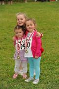 31 July 2011; Sister Ailbhe, two years, Tara, 4, and Shauna Mooney, from Leixlip, after the Athletics Ireland Family Fitness Festival at Farmleigh. Phoenix Park, Dublin. Picture credit: Ray McManus / SPORTSFILE