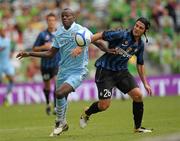31 July 2011; Cristian Chivu, Inter Milan, in action against Mario Balotelli, Manchester City. Dublin Super Cup, Inter Milan v Manchester City, Aviva Stadium, Lansdowne Road, Dublin. Photo by Sportsfile