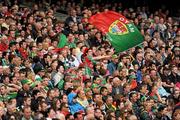 31 July 2011; A Mayo supporter flies the flag in the closing minutes of the game. GAA Football All-Ireland Senior Championship Quarter-Final, Mayo v Cork, Croke Park, Dublin. Picture credit: Ray McManus / SPORTSFILE