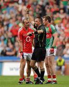 31 July 2011; Referee Rory Hickey, Clare, issues a red card to John Miskella, Cork, in the final minute . GAA Football All-Ireland Senior Championship Quarter-Final, Mayo v Cork, Croke Park, Dublin. Picture credit: Oliver McVeigh / SPORTSFILE