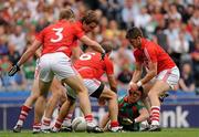 31 July 2011; Enda Varley, Mayo, is tackled by Eoin Cadogan, Cork, supported by Michael Shields, Aidan Walsh and John Miskella. GAA Football All-Ireland Senior Championship Quarter-Final, Mayo v Cork, Croke Park, Dublin. Picture credit: Oliver McVeigh / SPORTSFILE