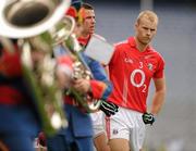 31 July 2011; The Cork captain Michael Shields leads his team behind the Artane School of Music Band in the traditional pre match parade. GAA Football All-Ireland Senior Championship Quarter-Final, Mayo v Cork, Croke Park, Dublin. Picture credit: Ray McManus / SPORTSFILE