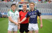 31 July 2011; Limerick captain for the game Ger Collins and Kerry captain Colm Cooper exchange a handshake before the game alongside referee Pat McEnaney. GAA Football All-Ireland Senior Championship Quarter-Final, Kerry v Limerick, Croke Park, Dublin. Picture credit: Diarmuid Greene / SPORTSFILE