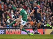 25 February 2017; Jonathan Sexton of Ireland chips ahead despite the efforts of Gael Fickou of France during the RBS Six Nations Rugby Championship game between Ireland and France at the Aviva Stadium in Lansdowne Road, Dublin. Photo by Ramsey Cardy/Sportsfile