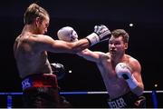 25 February 2017; Luke Keeler, right, in action against Lewis Taylor during their bout in the National Stadium in Dublin. Photo by Ramsey Cardy/Sportsfile