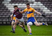 26 February 2017; Eóin Cleary of Clare is tackled by Luke Burke of Galway during the Allianz Football League Division 2 Round 3 match between Galway and Clare at Pearse Stadium in Galway. Photo by Ramsey Cardy/Sportsfile