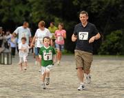 31 July 2011; Five year old James Nealon junoir, from Leislip, Co Kildare,  and his dad James run to the finish of the Athletics Ireland Family Fitness Festival at Farmleigh. Phoenix Park, Dublin. Picture credit: Ray McManus / SPORTSFILE