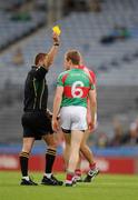31 July 2011; Referee Rory Hickey issues a yellow card to Mayo's Donal Vaughan. GAA Football All-Ireland Senior Championship Quarter-Final, Mayo v Cork, Croke Park, Dublin. Picture credit: Ray McManus / SPORTSFILE