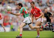 31 July 2011; Kevin McLoughlin, Mayo, on his way to scoring his side's goal while being chased by Eoin Cadogan, Cork. GAA Football All-Ireland Senior Championship Quarter-Final, Mayo v Cork, Croke Park, Dublin. Picture credit: Oliver McVeigh / SPORTSFILE