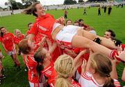 1 August 2011; Holly Hayes, Cork, is held aloft by her team-mates after the game. All Ireland Minor A Championship Final, Dublin v Cork, Birr, Co. Offaly. Photo by Sportsfile
