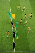 30 July 2011; Members of the Donegal team run out through flagbearers before the game. GAA Football All-Ireland Senior Championship Quarter-Final, Donegal v Kildare, Croke Park, Dublin. Picture credit: Ray McManus / SPORTSFILE