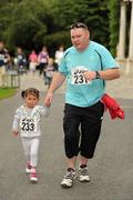 31 July 2011; Martin and three year old Afric Martin, Ashbourne, Co. Meath, in action during the Athletics Ireland Family Fitness Festival at Farmleigh. Phoenix Park, Dublin. Picture credit: Ray McManus / SPORTSFILE