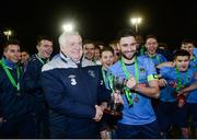 28 February 2017; Samir Belhout of UCD is presented with the cup by FAI president Tony Fitzgerald after the CUFL Final match between UCD and UCC at Home Farm in Dublin. Photo by Eóin Noonan/Sportsfile