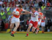 23 July 2011; Charlie Vernon, Armagh, in action against Sean O'Neill, Tyrone. GAA Football All-Ireland Senior Championship Qualifier Round 3. Tyrone v Armagh, Healy Park, Omagh, Co. Tyrone. Picture credit: Oliver McVeigh / SPORTSFILE