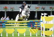 3 August 2011; Conor Swail, Ireland, competing on Coulthard 2, jumps the first during the Speed Stakes. Dublin Horse Show 2011, RDS, Ballsbridge, Dublin. Picture credit: Matt Browne / SPORTSFILE