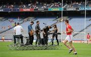 31 July 2011; Cork's Eoin Cadogan makes his way back out onto the field as Storyfold perform during half-time. GAA Football All-Ireland Senior Championship Quarter-Final, Mayo v Cork, Croke Park, Dublin. Picture credit: Diarmuid Greene / SPORTSFILE