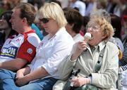 4 August 2011; Mary Smyth, from Ballsbridge, Dublin, enjoys an ice-cream as she watches the ladies day fashion show. Dublin Horse Show 2011, RDS, Ballsbridge, Dublin. Picture credit: Brian Lawless / SPORTSFILE