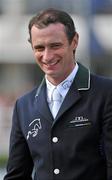 4 August 2011; Denis Lynch, Ireland, after placing second in the Power & Speed Event on Night Train. Dublin Horse Show 2011, RDS, Ballsbridge, Dublin. Picture credit: Brian Lawless / SPORTSFILE