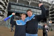 6 August 2011; Dublin supporters Peter Kelly and his son Daniel, age 13, from Clondalkin, Co. Dublin, cheer on their side before the GAA Football All-Ireland Senior Championship Quarter-Final, Dublin v Tyrone, Croke Park, Dublin. Picture credit: David Maher / SPORTSFILE