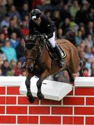 6 August 2011; Conor Swail, Ireland, competing on Vicar, fails to clear the &quot;Wall&quot; in the jump off during the Land Rover Puissance. Dublin Horse Show 2011. RDS, Ballsbridge, Dublin. Picture credit: Barry Cregg / SPORTSFILE