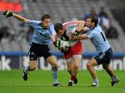 6 August 2011; Conor Gormley, Tyrone, is tackled by Dublin players Kevin Nolan and Bryan Cullen, right. GAA Football All-Ireland Senior Championship Quarter-Final, Dublin v Tyrone, Croke Park, Dublin. Picture credit: Ray McManus / SPORTSFILE