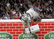 6 August 2011; Dave Quigley, Ireland, competing on Valetto Jx, fails to clear the &quot;Wall&quot; in the jump off during the Land Rover Puissance. Dublin Horse Show 2011. RDS, Ballsbridge, Dublin. Picture credit: Barry Cregg / SPORTSFILE