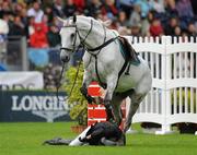 6 August 2011; Dave Quigley, Ireland, competing on Valetto Jx, is thrown from his mount after failing to clear the &quot;Wall&quot; in the jump off during the Land Rover Puissance. Dublin Horse Show 2011. RDS, Ballsbridge, Dublin. Picture credit: Barry Cregg / SPORTSFILE