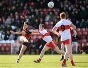 5 March 2017; Ryan Johnston of Down scores a point despite the tackle of Neil Forester of Derry during the Allianz Football League Division 2 Round 4 match between Derry and Down at Celtic Park, Derry, Co. Derry Photo by Oliver McVeigh/Sportsfile