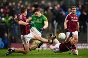 5 March 2017; Donal Lenihan of Meath shoots to score his side's first goal of the game despite the tackle of Cathal Sweeney, left, and Declan Kyne of Galway during the Allianz Football League Division 2 Round 4 match between Meath and Galway at Páirc Tailteann in Navan, Co Meath. Photo by Ramsey Cardy/Sportsfile
