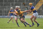 5 March 2017; John Conlon of Clare in action against Seamus Kennedy and Barry Haffernan of Tipperary during the Allianz Hurling League Division 1A Round 3 match between Tipperary and Clare at Semple Stadium in Thurles, Co Tipperary. Photo by Matt Browne/Sportsfile
