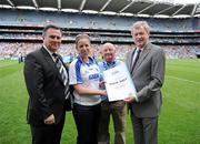 7 August 2011; Winner of the 1,000,000th GAA Championship Spectator of 2011 Carol Kiely, from Dungarvan, Co. Waterford, accompanied by her father Tommy, second right, is presented with her certificate by Páraic Duffy, Ard Stiúrthóir, Chumann Lúthchleas Gael, right, and Stadium Director Peter McKenna, left. The 1,000,000th Championship Spectator of 2011, Croke Park, Dublin. Picture credit: Ray McManus / SPORTSFILE