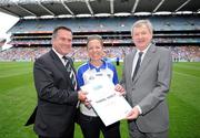 7 August 2011; Winner of the 1,000,000th GAA Championship Spectator of 2011 Carol Kiely, from Dungarvan, Co. Waterford, is presented with her certificate by Páraic Duffy, Ard Stiúrthóir, Chumann Lúthchleas Gael, right, and Stadium Director Peter McKenna. The 1,000,000th Championship Spectator of 2011, Croke Park, Dublin. Picture credit: Ray McManus / SPORTSFILE
